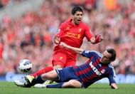 Dean Whitehead of Stoke City tackles Luis Suarez of Liverpool during the Barclays Premier League match between Liverpool and Stoke City at Anfield on October 7, 2012 in Liverpool, England.  (Photo by Clive Brunskill/Getty Images)